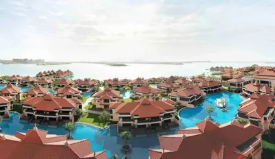 an aerial view of a resort with buildings and water at Anantara The Palm Dubai Resort in Dubai