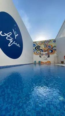 a large swimming pool with a sign on the wall at Citymax Hotel Business Bay in Dubai
