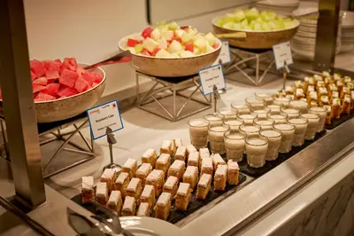 a buffet with various desserts and fruit on display at Citymax Hotel Business Bay in Dubai