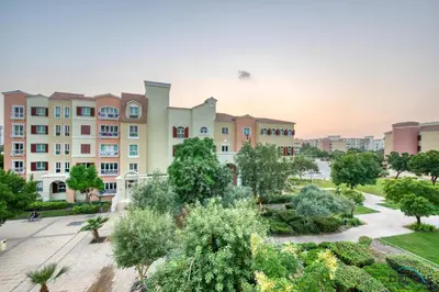 an aerial view of a building at Community Vibe Living with Wellness Access Close to Metro, Mediterranean, Discovery Gardens by Deluxe Holiday Homes in Dubai