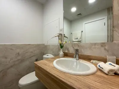 a bathroom with a sink and a toilet and a mirror at HiGuests - Amazing Sea Views from this 2BR Apt in JBR in Dubai