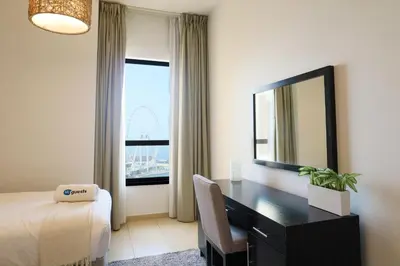 a hotel room with a desk and a mirror at HiGuests - Amazing Sea Views from this 2BR Apt in JBR in Dubai