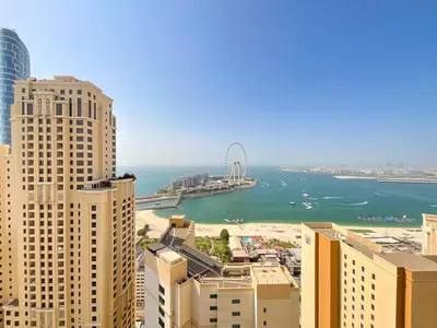 a view of the ocean from a city with tall buildings at HiGuests - Amazing Sea Views from this 2BR Apt in JBR in Dubai