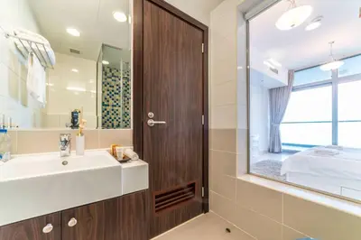 a bathroom with a sink and a mirror at Holiday Apartment in Palm Jumeirah with Beach Access in Dubai