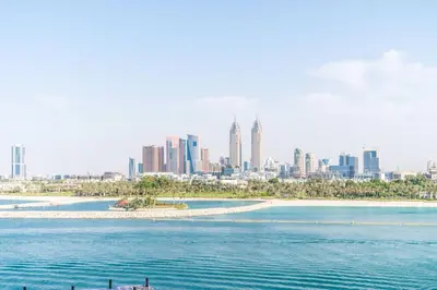 a view of a city from the water at Holiday Apartment in Palm Jumeirah with Beach Access in Dubai