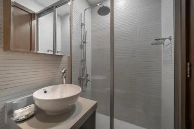 a bathroom with a sink and a glass shower at HiGuests - Spacious 1BR in Dubai Marina With Amazing Views in Dubai