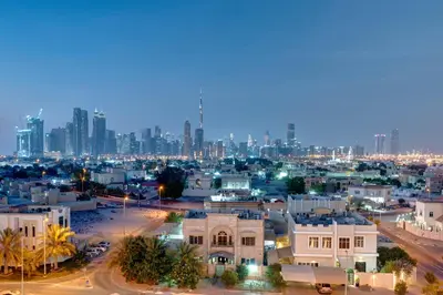 a city at night with a city skyline at URBAN Al Khoory Hotel in Dubai