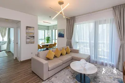 a living room with a couch and a table at Westminster Boulevard Central - Burj Khalifa in Dubai