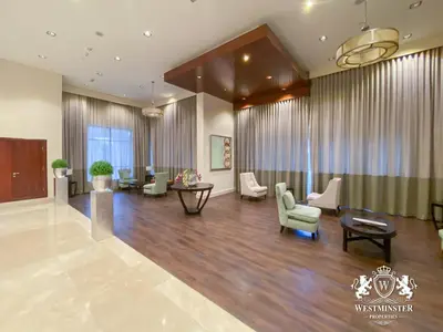 a lobby of a hotel with chairs and tables at Westminster Boulevard Central - Burj Khalifa in Dubai