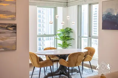 a dining room with a table and chairs at Westminster Boulevard Central - Burj Khalifa in Dubai