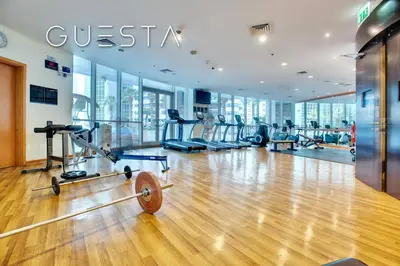 a gym with exercise equipment in a building at The Waves by DAMAC, Dubai Marina in Dubai