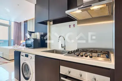 a kitchen with a sink and a stove at Staycae Holiday Homes - Upper Crest in Dubai