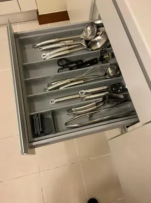 a drawer in a kitchen with silver utensils at Address Dubai Mall Fashion Avenue 1 bedroom 34 floor in Dubai