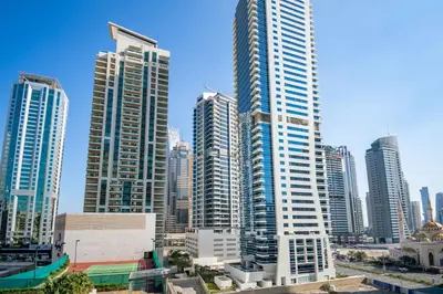 a group of tall buildings in a city at Stylish and Sleek 1 Bed + Study near the JBR beach in Dubai