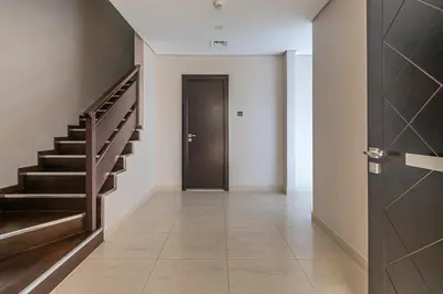 a hallway with a staircase and a door and a hallway sidx sidx sidx at Frank Porter - Mon Reve in Dubai
