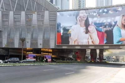 a large billboard on the side of a building at Frank Porter - Mon Reve in Dubai