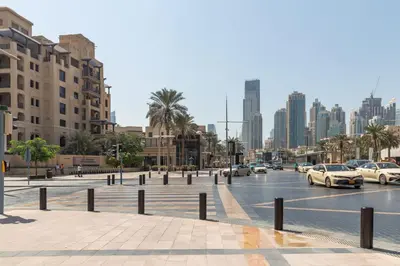 a city with cars parked on a street with buildings at Frank Porter - Mon Reve in Dubai
