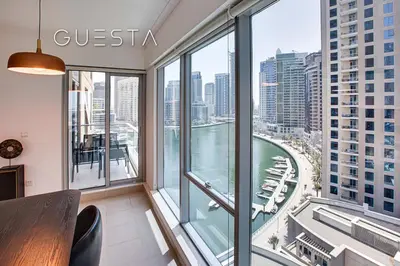 a room with a view of a river and buildings at Marina Promenade - Paloma Tower, Dubai Marina in Dubai