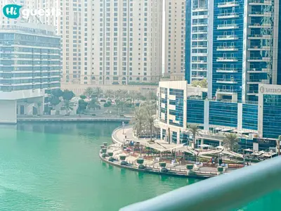 a view of a city with tall buildings and a river at HiGuests - Deluxe Apartment With Balcony and Amazing Views in Dubai