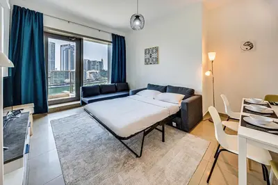 a living room with a couch and a table at 5 star Sparkle Tower by Swarovski, Dubai Marina in Dubai