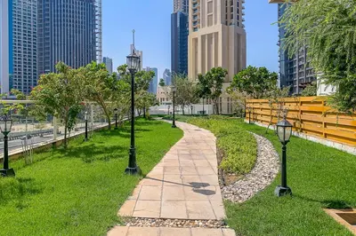 a walkway in a park in the middle of a city at Frank Porter - Mon Reve in Dubai