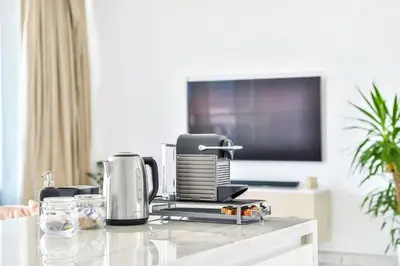 a coffee maker on a counter in a living room at Contemporary and Spacious 2 BR in Bluewaters Island in Dubai