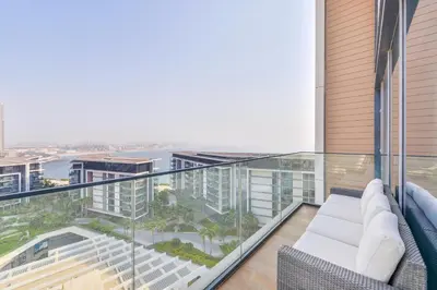 a balcony with a view of a city at Spectacular 3 BR condo with maids room facing the Dubai Eye in Dubai