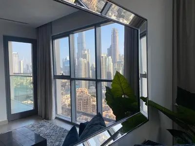 a room with a large window with a view of the city at BELLEVUE Downtown Dubai in Dubai