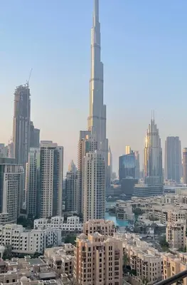 a view of a large city with a tall skyscraper at BELLEVUE Downtown Dubai in Dubai