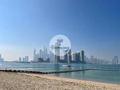 a view of the dubai skyline from the beach at Harmony Vacation Homes - South Residence in Dubai