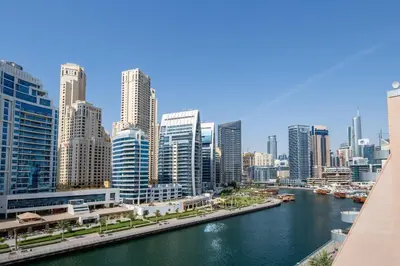 a view of a city with a river and buildings at Frank Porter - Panoramic Tower in Dubai
