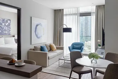 a living room with a couch and a table at Jumeirah Living Marina Gate in Dubai