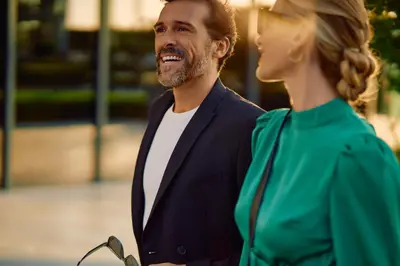 a man and a woman standing next to each other at Jumeirah Living Marina Gate in Dubai