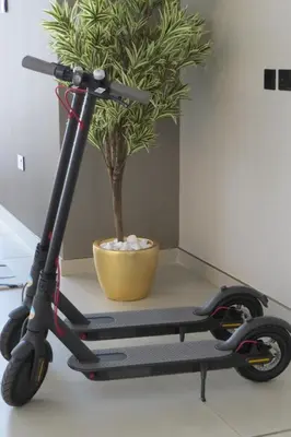 a scooter on a table next to a potted plant at Beach Walk Hotel Jumeirah in Dubai