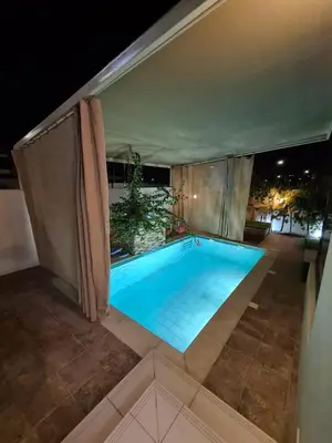 a large swimming pool on top of a building at 5 bedroom Villa - Dubai Hills in Dubai