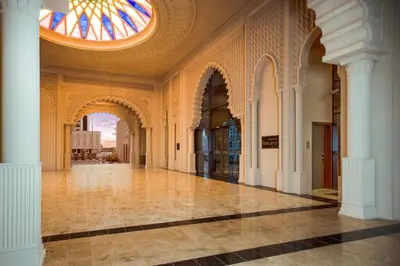 a hallway of a building with a stained glass ceiling at Al Jaddaf Rotana Dubai in Dubai