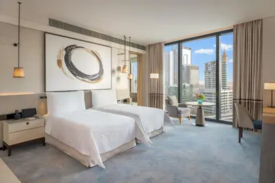 a hotel room with a bed and a large window at Address Beach Resort in Dubai