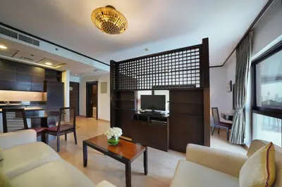 a living room with a couch and a table at Park Apartments Dubai, an Edge By Rotana Hotel in Dubai