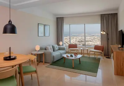 a living room with a couch and a table at Staybridge Suites Dubai Financial Centre by IHG in Dubai