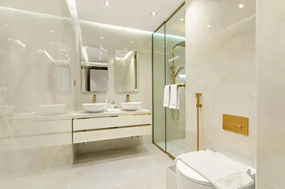 a white bathroom with two sinks and a shower at Spacious 3BR in Downtown, Direct Access to Dubai Mall & Metro, Burj Khalifa Views in Dubai