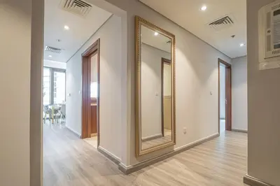 a hallway with a large mirror on the wall at Spacious 3BR in Downtown, Direct Access to Dubai Mall & Metro, Burj Khalifa Views in Dubai