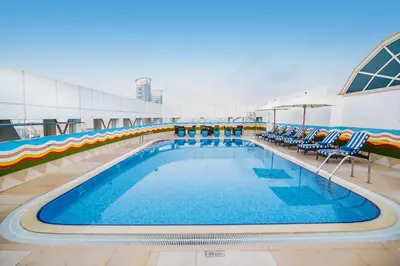 a large swimming pool on a cruise ship at Grand Excelsior Hotel Bur Dubai in Dubai