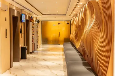 a hallway with a long couch in a building at Majestic City Retreat Hotel in Dubai
