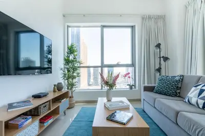 a living room with a couch and a coffee table at The Smart Concierge - Bay Central in Dubai