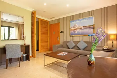a living room with a couch and a table at Dubai Marine Beach Resort & Spa in Dubai