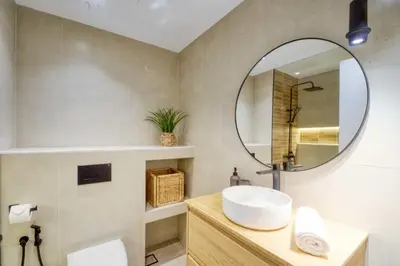 a bathroom with a sink and a mirror at The Smart Concierge - Discovery Gardens street 4 in Dubai