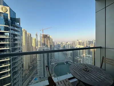 a balcony with a table and a view of a city at Awesome Marina Canal View 1BD Bay Central Marina in Dubai