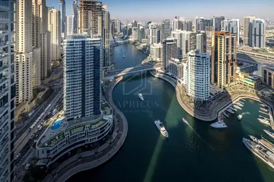 an aerial view of a city with a river and buildings at Awesome Marina Canal View 1BD Bay Central Marina in Dubai