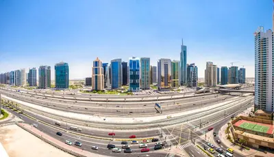 a highway in a large city with many buildings at Stylish Studio in West Avenue Dubai Marina in Dubai