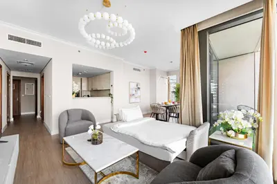 a living room with a couch and a table at FIRST CLASS 3BR with full BURJ KHALIFA and FOUNTAIN VIEW in Dubai